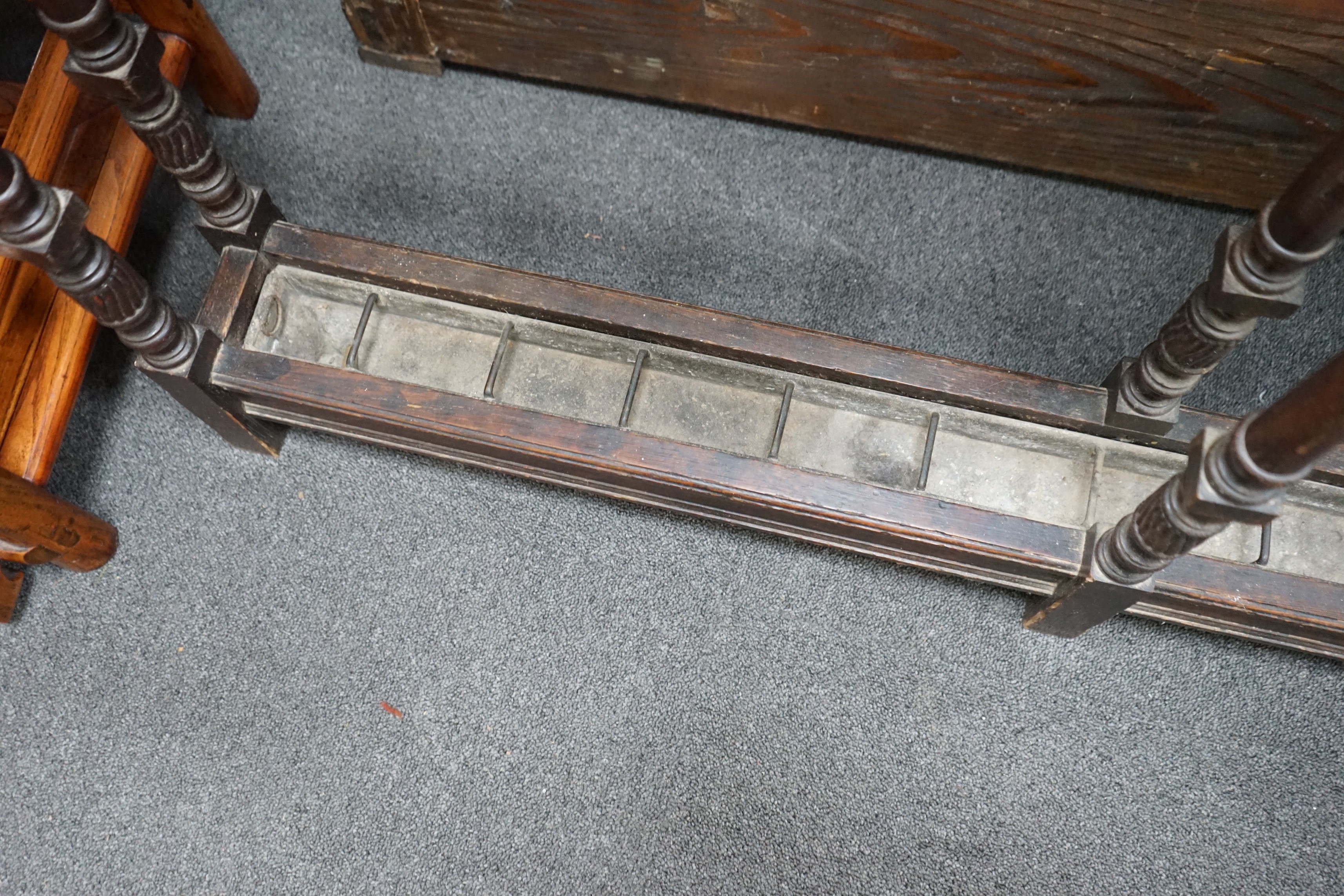 A large Victorian oak club stickstand, with zinc drip trays, width 122cm, depth 14cm, height 77cm